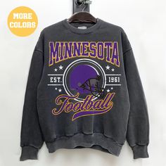 the minnesota football sweatshirt is hanging on a wall