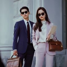 a man and woman dressed in business attire