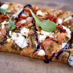 a close up of a pizza with toppings on it