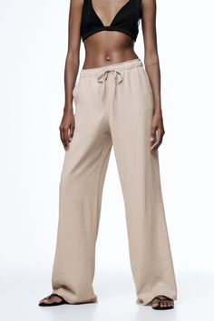 Casual Wide-leg Pants With Belted Cuffs, Zara Ankle-length Pants With Side Pockets, Zara Ankle-length Bottoms With Side Pockets, Trendy Belted Straight Pants, Casual Relaxed Fit Belted Pants, Casual Straight Leg Belted Pants, Casual Wide Leg Belted Pants, Casual High-waisted Pants With Belted Cuffs, Chic Relaxed Fit Belted Pants