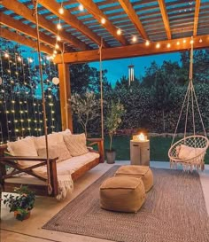 an outdoor living area with swings and lights