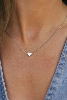 The most simple necklaces always make for the most memorable memories. Treat yourself or a loved one to our Simple Heart Necklace. This necklace features a silver heart, a dainty chain, secure clasp and a sterling sliver material so you know this necklace will last you past February! Length: 18" Simple Heart Necklace-Sterling Silver, boutique clothing, casual, the perfect necklace! Boutique Clothing Silver Necklaces For Women, Heart Necklace Aesthetic, Basic Necklace, Simple Heart Necklace, Simple Necklaces, Stackable Necklaces, Silver Necklace Simple, Pretty Jewelry Necklaces, Silver Jewelry Necklace