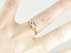 We've set this pink sapphire ring with a sweet, cherry blossom pink sapphire from Sri Lanka. This rosy gem has rich, even color that pops with light! Faceted by hand, this gem has been shaped and polished to enhance the rich, rosy glow! Created from a vintage master model of timeless perfection, this mounting is not a reproduction, not an imitation of an antique style. In fact, it is a true re-issuing of an original design created by a master jeweler, a unique style carved and shaped decades ago Yellow Gold Sapphire Ring, Demantoid Garnet, Ring Sapphire, Sapphire And Diamond Ring, Pink Sapphire Ring, July Birthstone, Sapphire Engagement, Eternity Bands, Antique Style