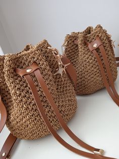 Crochet Luxury Bucket Shoulder Bag , Straw Bucket Bag,Knitted Bag For Women, Handmade Crossbody Bag ,Handbags for Women, Gifts for Her It has a leather strap. A completely crocheted bag whose shape remains stable thanks to the strengthening of the bag! A perfect bag with paper string! I use only high quality ingredients for a perfect result. Height: 19 cm /7 inches(approx) Base Width: 12cm/5 inches (approx) This wonderful crochet bag is the perfect accessory for your outfit. Of course, you know Beige Crochet Bucket Bag With Phone Holder, Beige Crochet Bucket Bag With Phone Pocket, Beige Crochet Backpack For Travel, Beach Crochet Backpack, Brown Bucket Straw Bag With Phone Holder, Brown Straw Backpack With Adjustable Strap, Trendy Brown Crochet Pouch Bag, Brown Backpack Shoulder Bag For Beach, Brown Crochet Tote Bag For Mobile Phone