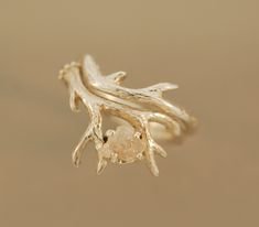 a close up of a gold ring on a table