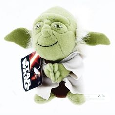 a star wars yoda plush toy with a tag