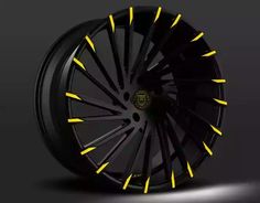 a black wheel with white spokes on a dark background