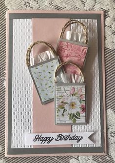 a birthday card with flowers on it and some cards attached to the back of each card