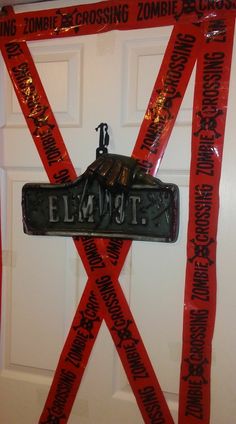 there is a sign on the door that says elmtt and has red tape wrapped around it