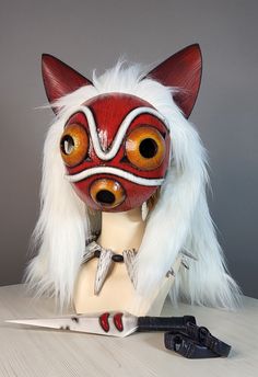 A stunning Wolf Princess mask with a fur cape and ears will complement your cosplay costume or holiday look! *Functions:* - Lightweight and ultra-durable (molded plastic) - ALREADY COMPLETED, POLISHED AND PAINTED - fur can be unfastened - the ears are made of eva and sewn to fur Size: - height 23 cm -width 20.5cm *Does not require finishing. Buy. Receive. Wear.* You can contact me for a custom order if you need a different color (or a different design). *IMPORTANT* International shipping average Cosplay Masks For Fantasy Events, Fantasy Cosplay Events Mask And Costume Accessories, Fantasy And Cosplay Events Mask, Fantasy Costume Mask For Cosplay, Cosplay Costume With Cat Ears For Cosplay Events, Red Themed Cosplay Masks And Prosthetics, Red Masks And Prosthetics For Cosplay, Themed Masks And Prosthetics For Cosplay Carnival, Novelty Mask For Costume Party And Cosplay Events