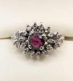 Ladies 14K white gold Starburst Cluster Ring with Natural Ruby and 20 single cut Diamonds. Appraised at $5,845.00 (appraisal in photos). Size is 5 1/4. Selling for $1,645.00 Formal Ruby Ring With Diamond Accents In Cluster Shape, Formal Cluster Ruby Ring With Diamond Accents, Cluster Diamond Ruby Ring In White Gold, White Gold Cluster Ruby Ring With Diamonds, Dazzling Ruby Ring With Diamond Accents, White Gold Ruby Ring With Diamond Accents, Formal Silver Ruby Ring With Single Cut Diamonds, 14k White Gold Silver Cluster Ring With Gemstone, Silver Cluster Ring With Gemstone In 14k White Gold