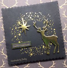 a close up of a christmas card with two reindeers and stars on the back