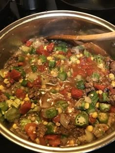 a metal pan filled with food on top of a stove