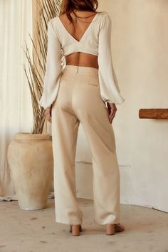 Your spring fit just got that much better thanks to the Jaxon Cream Trousers. Wear from work to happy hour, these pants are easily dressed up or down. Style with your favorite crop, our Isla Straw Fedora, a pair of strappy sandals, and you're set for the entire day! PRODUCT DESCRIPTION AND MATERIALS: - cream wide leg trousers - pleated - button closure - functional front pockets - non-functional welt back pockets - high waisted fit - finished hem - 100% lyocell - dry clean only SIZE RECOMMENDATI Non-stretch Spring Dress Pants, Versatile Wide Leg Spring Dress Pants, Versatile Wide-leg Spring Dress Pants, Chic Non-stretch Wide Leg Spring Pants, Wide Leg Pants For Date Night In Spring, Spring Wide Leg Versatile Dress Pants, Wide Leg Pants For Spring Date Night, Spring Wide Leg Dress Pants, Versatile Spring Dress Pants For Work