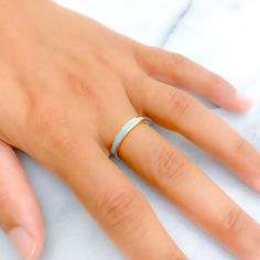 This 22k gold ring exudes upscale elegance with its subtle sky blue enamel, complementing a bright yellow gold finish. Weighing 4.5 grams and sized at 6.75, it offers a refined touch of color that enhances its luxurious appeal. Ideal for those seeking a sophisticated accessory with a gentle hue, this band seamlessly blends timeless design with a modern twist. The absence of sizing options ensures that the ring maintains its perfect contour and exquisite craftsmanship. PRODUCT DETAILS Gold Purity Blue Polished Enamel Ring, Blue Enamel Ring With Polished Finish, Blue Enamel Polished Round Ring, Blue Enamel Ring With Polished Finish As Gift, Blue Enamel Ring With Polished Finish For Gift, Modern Yellow Gold Enamel Ring With Polished Finish, Blue Hallmarked Enamel Ring, Minimalist Yellow Gold Enamel Ring For Formal Occasions, Blue 14k Gold Enamel Ring For Formal Events