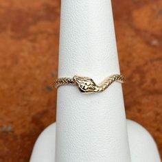 14KT yellow gold snake wave band ring with diamond eyes. Size 7 May be doable in other sizes Weight: 2.22 grams Band width: 2.1mm Solid 14k gold (2) diamonds; 1 on each eye Genuine diamonds Gold Fine Jewelry Snake-shaped Ring, 14k Gold Snake Shape Ring For Anniversary, 14k Gold Snake Ring For Anniversary, Adjustable Fine Jewelry Snake Ring For Anniversary, Yellow Gold Snake-shaped 14k Gold Rings, Adjustable Yellow Gold Snake-shaped Ring, 14k Gold Snake-shaped Ring, 14k Gold Snake Jewelry For Anniversary, Adjustable 14k Gold Snake Ring For Anniversary