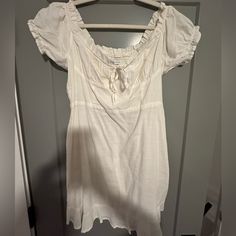 Urban Outfitters White Short Sleeve Dress - Size Large, Never Worn -Originally $60 -Tied Bow At Front White Mini Dress With Tie Waist For Vacation, White Tie Waist Mini Dress For Summer, White Mini Dress With Tie Waist, White Summer Mini Dress With Tie Waist, White Fitted Mini Dress With Tie Waist, White Casual Mini Dress With Tie Back, Casual Mini Dress With Tie Back For Daywear, White Short Sleeve Mini Dress With Tie Back, Casual Urban Outfitters Mini Dress For Daywear