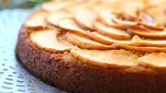 a close up of a cake with apples on it