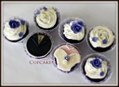 six cupcakes with white frosting and blue flowers on them are arranged in rows