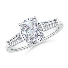 a diamond engagement ring with baguets on the shoulders and side stones in white gold