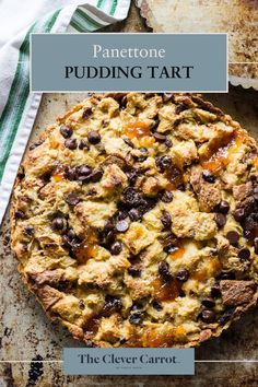 a close up of a pie on a pan with the words panettoe pudding tart above it