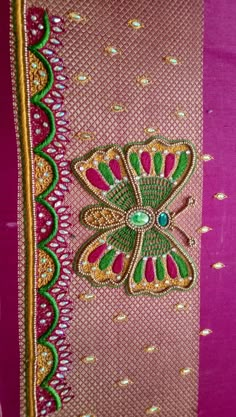 pink and green fabric with an intricate design on the front, along with gold trimmings