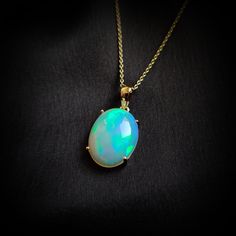 This stunning Pendant is set in 14k Solid Yellow Gold with Natural Ethiopion White Opal with utmost precision. It is a unique gemstone Pendant for nearly every occasion and is completely hassle-free jewelry. ITEM DETAILS: * GEM: Ethiopion White Opal  * GEM SIZE: 12X16mm * GEM SHAPE: Oval * Gem weight: 4.30 carats * Gold Purity: 14KT  * Gold Weight: 0.73 gram * Total Weight of the Pendant: 1.59 gram The Gold purity is guaranteed and it comes with authentic 14KT gold hallmark. Since my items are h Oval Yellow Gold Jewelry For Celebrations, Luxury Hallmarked Opal Jewelry, Exquisite Yellow Gold Gemstones For Gifts, Handmade Jewelry Box, Bezel Pendant, Birthstone Pendant, Milky White, Unique Gemstones, October Birthstone