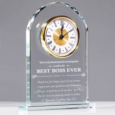 a glass clock with the words best boss ever written on it's front and back sides