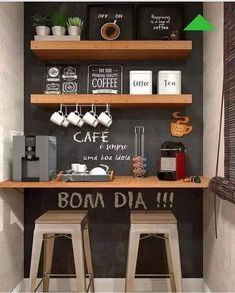 two wooden stools sitting in front of a chalkboard wall with writing on it