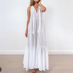 Honorine's Eve Tie-Neck Double Cotton Gauze Maxi Dress In White Is A Fabulous And Versatile Summer Dress. This Gorgeous Slightly Oversized, Floor Length Maxi Dress Has A Breezy, Tiered Shape, That Flows And Feels Almost As If You Are Wearing Nothing, Also, Featuring A Deep V Open Neck, Also A Self Tie Bow For A Little Modesty, If The V Is A Little Deeper Than You Like! Perfect Beach Dress, Vacation Dress, Throw On, Cover Up, Barefoot, With Flip-Flops, Sandals, And Or Wedges! - Keep In Mind It Is White V-neck Sundress For Vacation, White V-neck Sundress For Beach, White Free Size V-neck Beach Dress, Flowy Cotton V-neck Beach Dress, White V-neck Maxi Dress For Beach, White Gauze Dress, White Maxi V-neck Dress For Beach, White Chiffon V-neck Maxi Dress, White Maxi-length V-neck Beach Dress