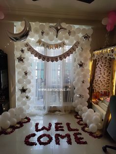 balloons and streamers decorate the entrance to a new year's eve themed party