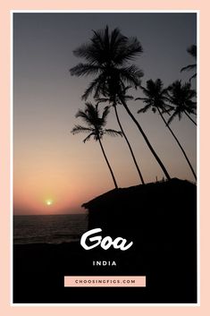 the sun is setting behind palm trees with the words goa india in front of it