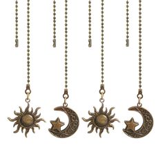 three sun and moon pendants hanging from chains