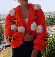 COLOR: orange (different colors can be knitted upon order.) PATTERN: daisy bee SIZE: xs. s. m. l (size xl. xxl can be knitted upon order.) LENGTH: (can be knitted to the desired length upon order.) AREA OF USE: daily use and can be given as a gift WASHING INSTRUCTIONS: short program at low temperature PACKAGING: safe packaging and gift wrap SHIPPING: safe cargo company and on-time delivery You can see my other cardigans on sale by visiting my store. Thank you for visiting my store. Title: "Warm Orange Knitted Long Sleeve Outerwear, Cozy Orange Outerwear For Spring, Spring Orange Knitted Cardigan, Orange Knitted Spring Sweater, Orange Knitted Sweater For Spring, Spring Orange Knitted Sweater, Casual Orange Hand Knitted Sweater, Spring Orange Knit Outerwear, Orange Knit Outerwear For Spring