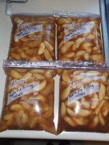 three packages of apple pie fillings sitting on top of a counter