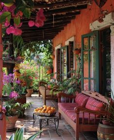 an outdoor patio with potted plants and flowers