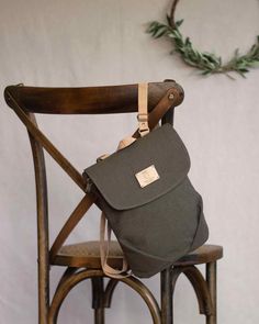 This olive green little backpack purse will be perfect for your trips and walks . It is your best option for weekends, or when you're not carrying a lot of stuff. It's little but has a lot of space inside. This mini travel backpack has a zippered pocket on the back, and another two pockets inside to store small things. Its shape, with the flap and the folds, gives it a very feminine appearance without losing a cozy style. Easy to open,a metallic zipper and a hidden metallic closure under the fla Vegan Backpack, Canvas Rucksack, Backpack For Women, Belt Pouch, Small Canvas, Small Backpack, Canvas Backpack, Khaki Color, Green And Khaki