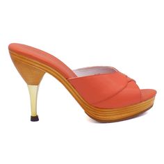 This iconic 1950's style stiletto slide is comfortable and sexy with a padded foot-bed and stable base.  Leather uppers with blond wood platform sole Whole sizes, 5-11 4½" metallic finished stiletto heel with a ⅞" laminated wood platform  Imported Modern Slip-on Heels With Wooden Heel, Fitted High Heel Mules With Deep Heel Cup, Formal Pointed Toe Platform Mules, Formal Platform Mules With Open Heel, Evening Platform Slippers With Open Heel, Elegant Slip-on Heels With Wooden Heel, Retro Platform Heels For Formal Occasions, Elegant Platform Slippers With Open Heel, Formal High Heel Platform Mules