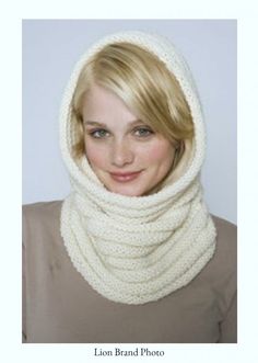 a woman wearing a white knitted cowl