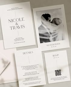 the wedding stationery is laid out on top of each other