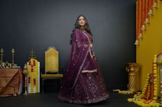 Plum Purple mirror work lehenga choli Matched with Purple mirror work blouse with quarter sleeves. Designed with round neck and has back hooks. Set together with a matching soft net purple duppata with mirror work and have gold border The length of the blouse is 14 inches. Blouse can fit a size 32 to 42 The maximum length of the lehenga will be 41 inches. Slight variation in color is possible due to digital photography. This is a 3 piece set. Care: dry clean only We provide side fitting/sleeves Designer Purple Chanderi Choli, Purple Choli With Sheer Dupatta In Chanderi, Purple Chanderi Choli With Sheer Dupatta, Purple Dola Silk Lehenga With Cutdana, Purple Dola Silk Lehenga With Gota Work, Purple Chanderi Lehenga With Cutdana, Purple Chanderi Lehenga With Gota Work, Purple Lehenga With Gota Work In Dola Silk, Festive Purple Chanderi Lehenga