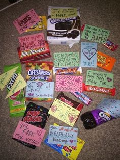 many different candy bars are laid out on the floor with words written on them, including i love you