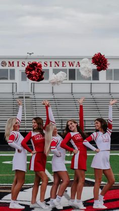 the cheerleaders are all dressed in red and white