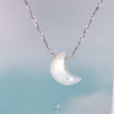 This elegant crescent moon pendant necklace features a crescent moon shape moonstone with blue flash, on solid 925 sterling silver cable chain and platinum plating. Add this elegant crescent moon moonstone pendant necklace to your everyday fine jewelry collection or as gift for your loved ones. Pendant dimensions: 0.68 x 0.48 inNecklace length: 17.5 in with the adjustable ballMaterials: moonstone, 925 sterling silver Jewelry Care: See more information about how to care for your jewelry here. Shipping Policy: Orders will be shipped within 1-3 business days. Economy shipping will take 7-14 days to arrive and standard shipping is 1- 4 days for U.S. orders. International shipping time is depended on the country and per shipping method. Shipping cost will be calculated at check out.For more det White Moonstone Jewelry With Moon Charm, White Moon Phase Necklace, White Moon Charm Necklace, White Sterling Silver Necklace With Moon Charm, Elegant Crescent Moonstone Jewelry, White Moonstone Crystal Necklace With Moon Charm, Moon-shaped Moonstone Jewelry In White Gold, White Gold Moon-shaped Moonstone Jewelry, Moonstone Moon Charm Jewelry