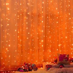 a room with lights and teddy bears on the floor