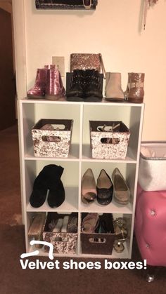 a white shelf filled with lots of shoes next to a pink bag and purses