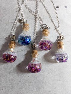 This mini potion bottle necklace filled with gorgeous glitter and resin makes a great for yourself or someone you love! Small Bottle Necklace, Resin Potion Bottles, Potion Bottle Earrings, Bottle Necklace Diy, Potion Bottle Necklace, Floral Witch, Sci Fi Jewelry, Magical Potion, Cork Necklace