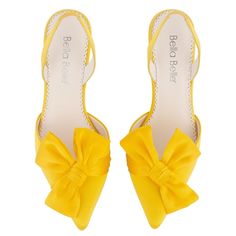 Bella Belle x Milla Nova presents this limited edition collection focusing on charity efforts. 20% of proceeds will be donated to charities assisting Ukrainian refugees. These vibrant yellow slingback pumps feature asymmetrical bow detailing and a modern pointed heel. The rich yellow hue represents strength and adds an understated polish to these clean-cut yellow slingback heels with bow detailing. The pointed toe is complete with a knotted silk bow at a diagonal. Reviews suggest this style runs Yellow Open Toe Slingback Pumps For Party, Chic Yellow Slingback Pumps For Party, Yellow Slingback Heels For Summer, Yellow Slingback Pumps For Party, Yellow Slingback Heels For Party, Yellow Pointed Toe Sandals With Padded Heel, Yellow Ankle Strap Slingback Pumps For Party, Yellow Sandals With Padded Heel And Pointed Toe, Elegant Yellow Sandals With Wrapped Heel