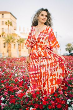 This dress is for she who loves Amalfi! This gorgeous tie-dye pattern is printed in Italy on the most luxurious silk crepe fabric available. This Pax Max dress is to be worn whilst sitting in front of the Amalfi cathedral enjoying an Aperol spritz, on a beautiful sunny day in the south of Italy. You will be as enchanting as Amalfi when you wear this beautiful dress! Length 54" one size, drawstring waist fits all. Dry Clean. Made in India of 100% Italian silk crepe. Bohemian Silk Dress With Ikat Print, Flowy Tie-dye Batik Print Dress, Summer Festival Dress With Ikat Print, Flowy V-neck Batik Print Dress, Red Batik Print Dress For Spring, Amalfi Cathedral, Silk Crepe Fabric, South Of Italy, Beautiful Sunny Day