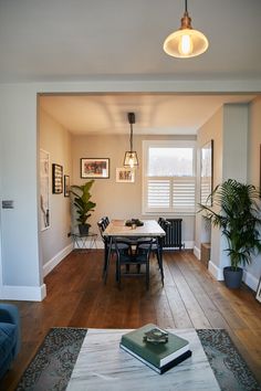 a living room filled with furniture and a table